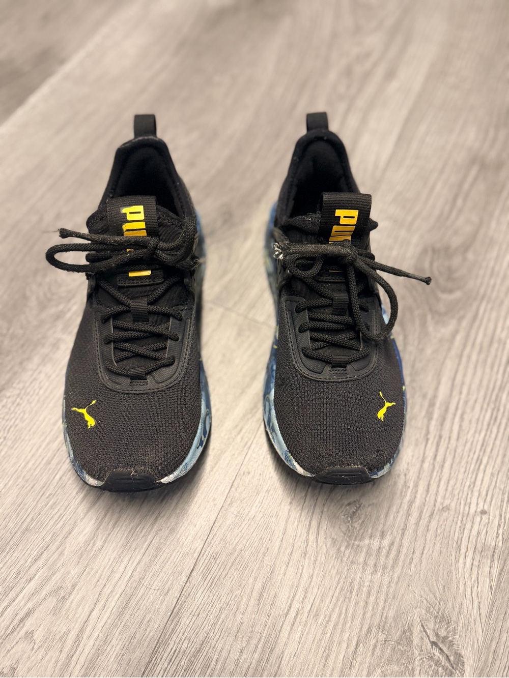 Puma Black Knit Sneakers with Yellow Logo and Blue Accents